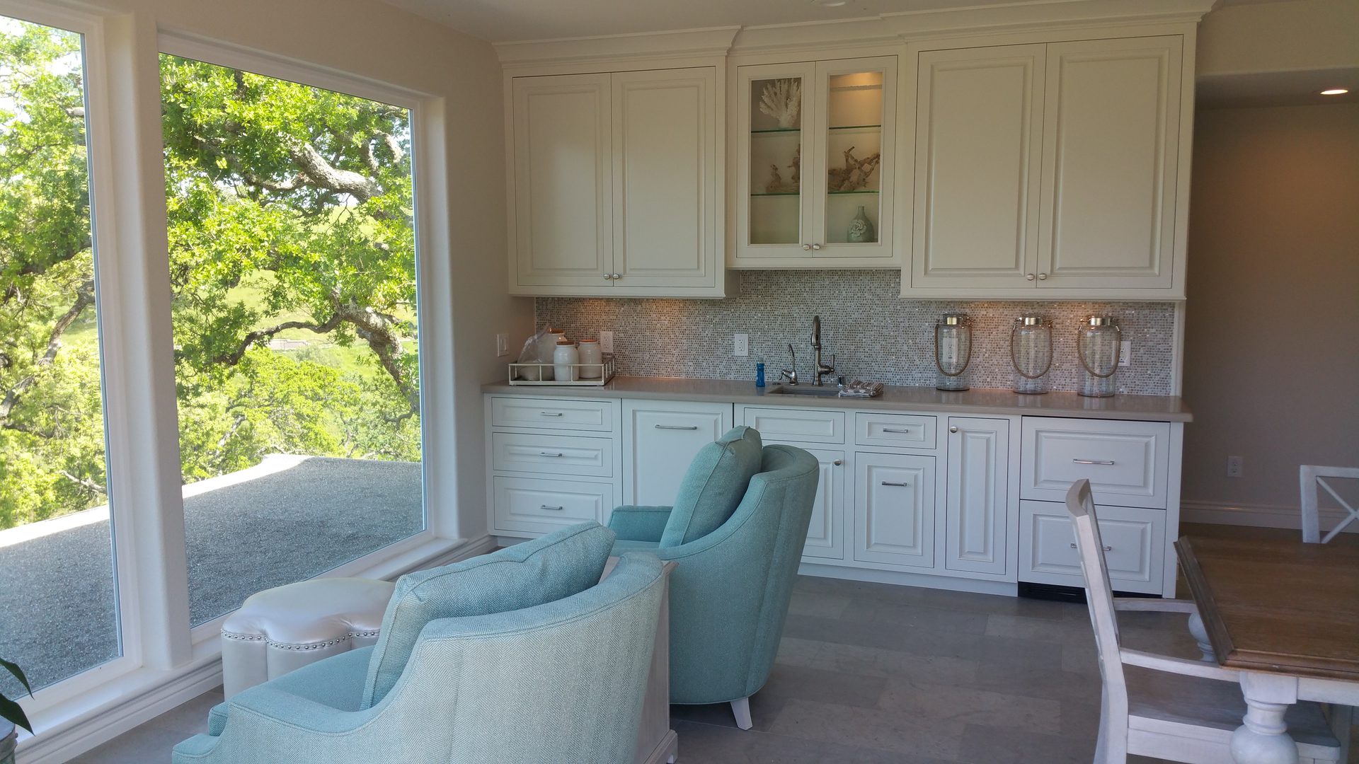 Elegant kitchen with light blue chairs