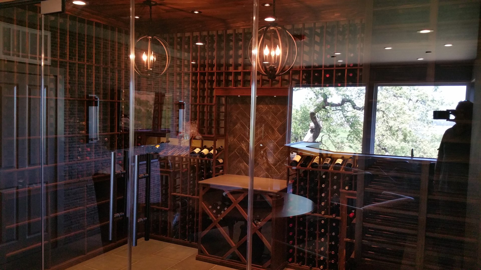 Glass-enclosed wine cellar interior