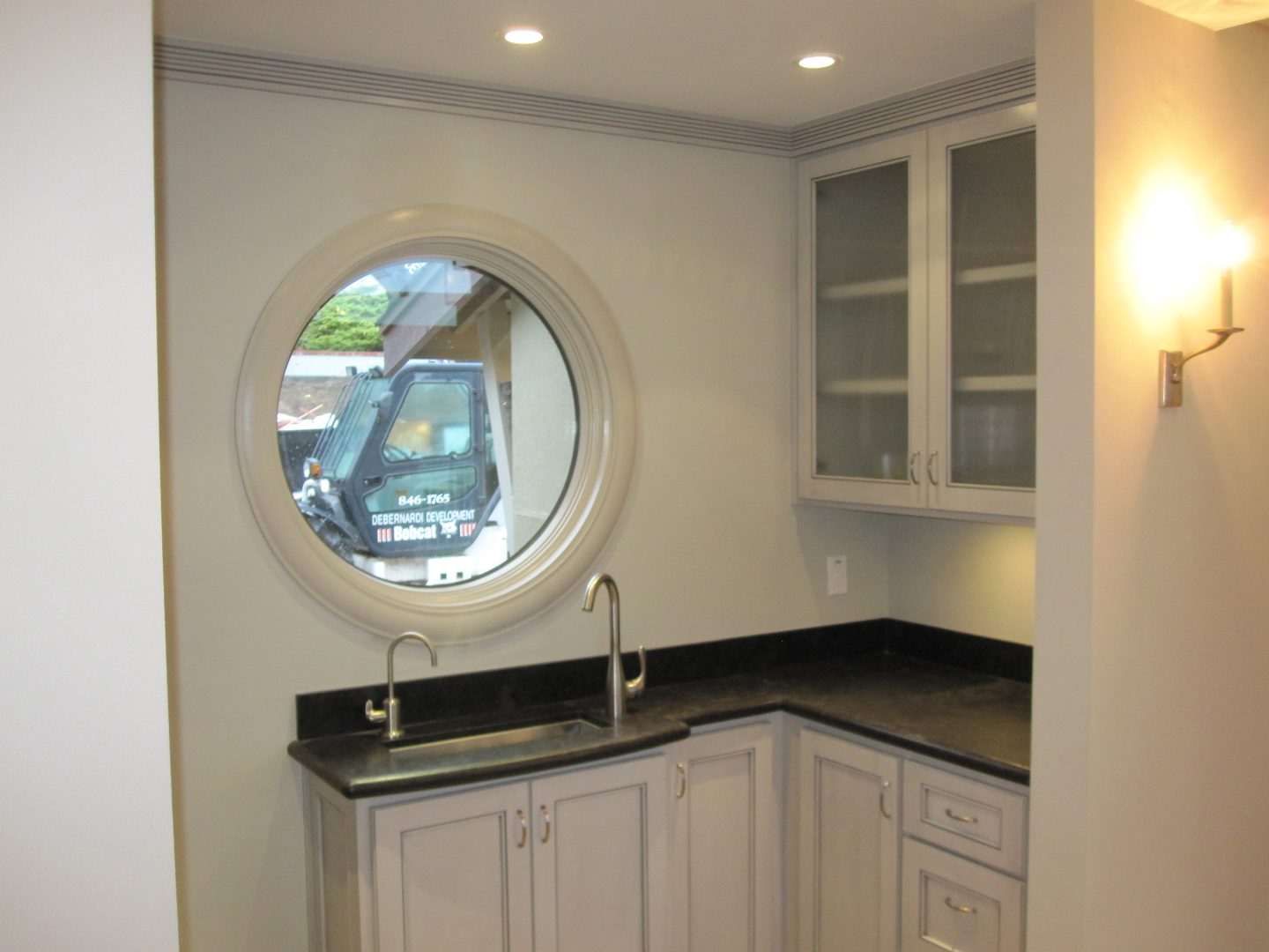 Contemporary kitchen with circular window