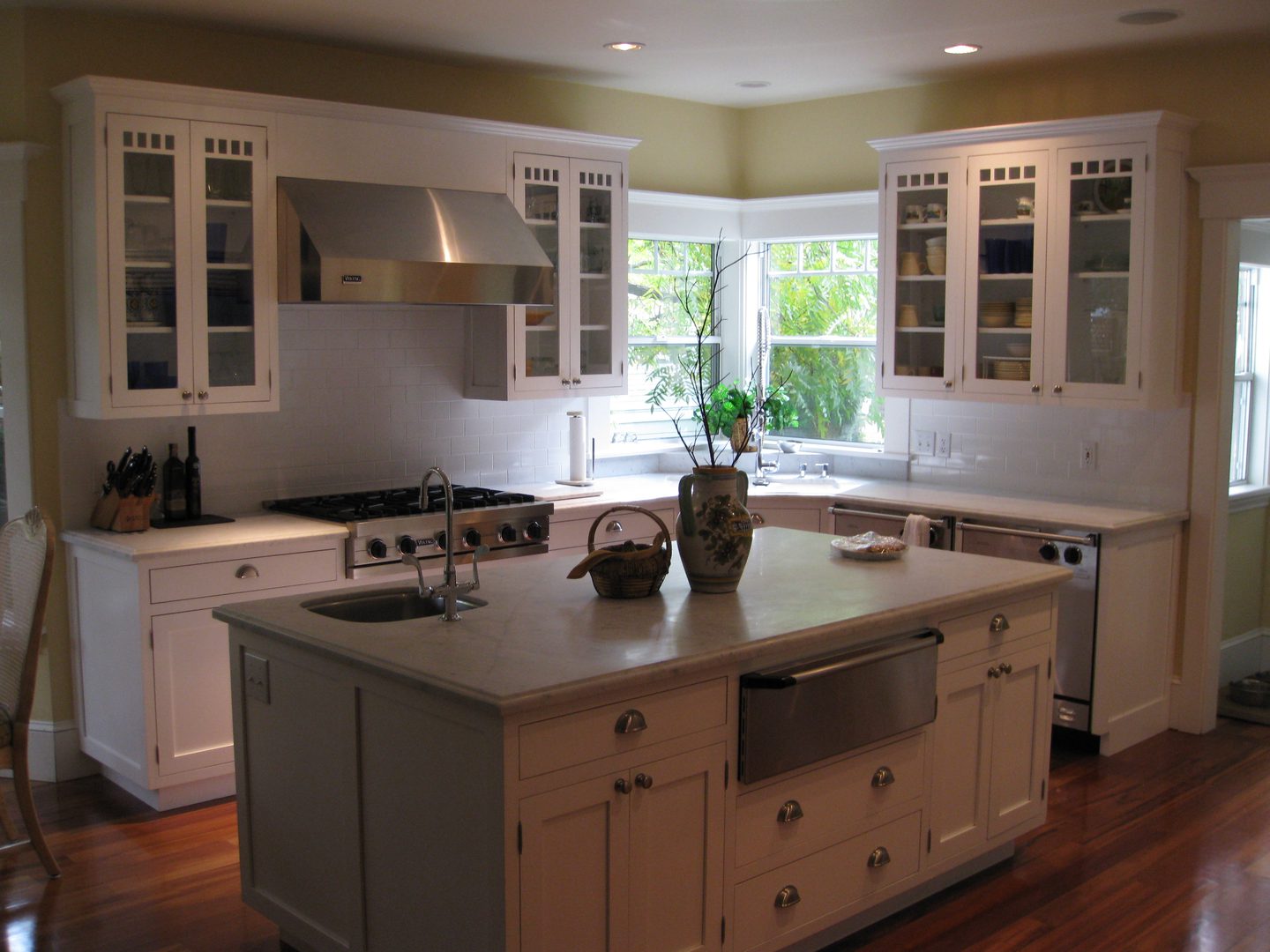 Spacious kitchen with island and plants