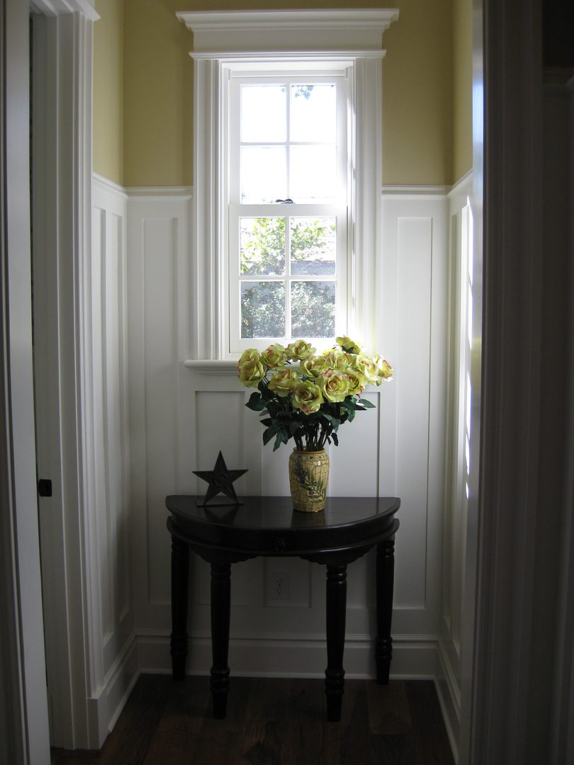 Narrow hallway with decorative table