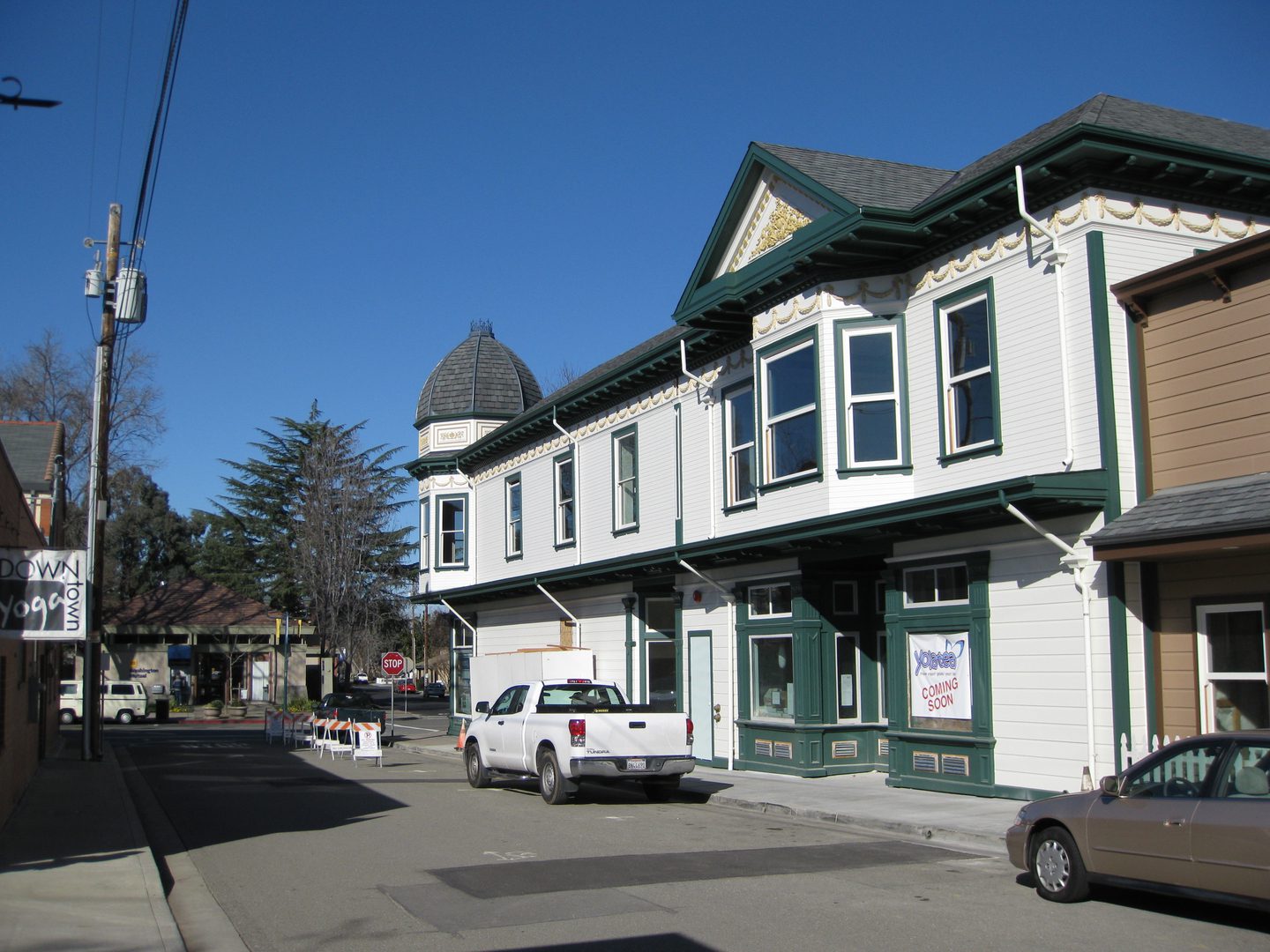 Street with vintage buildings and parked vehicles