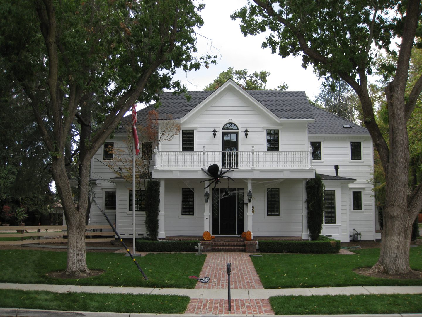 Two-story home with brick pathway