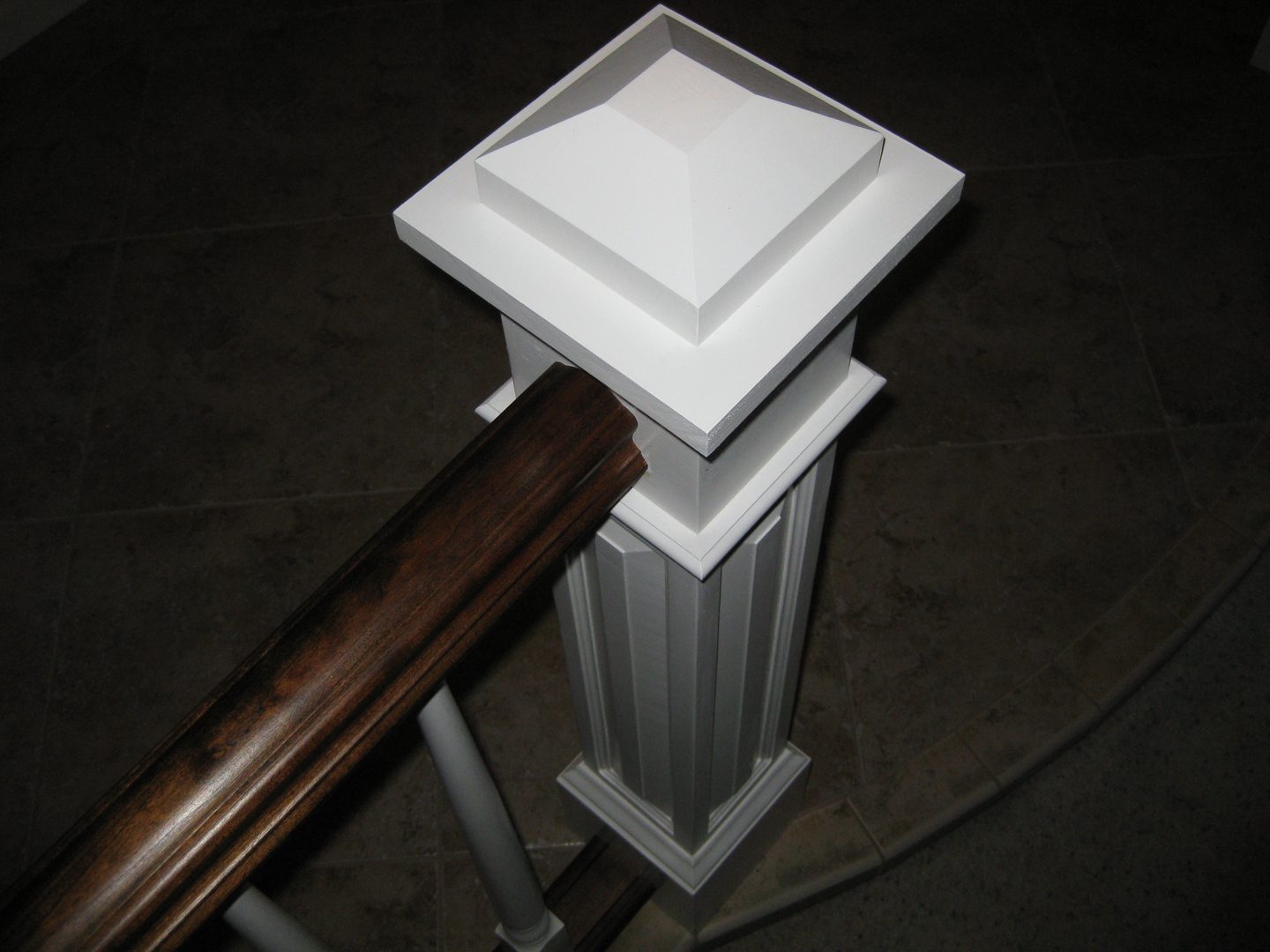 Decorative white newel post detail