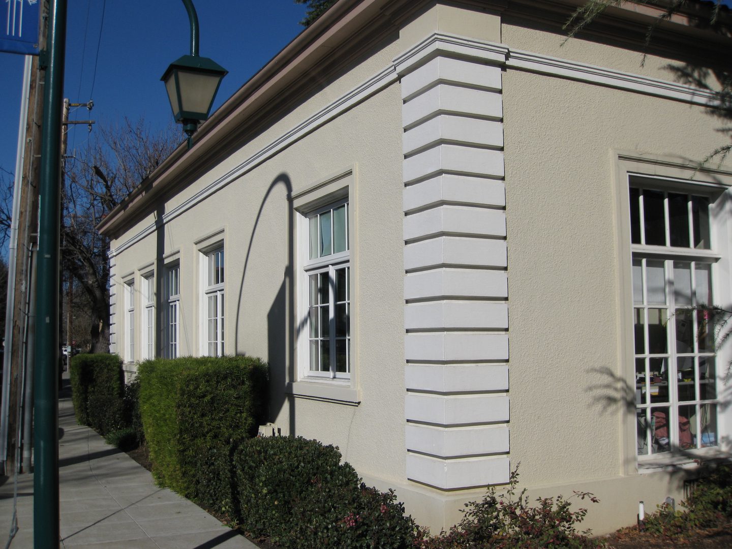 Street corner with trimmed bushes