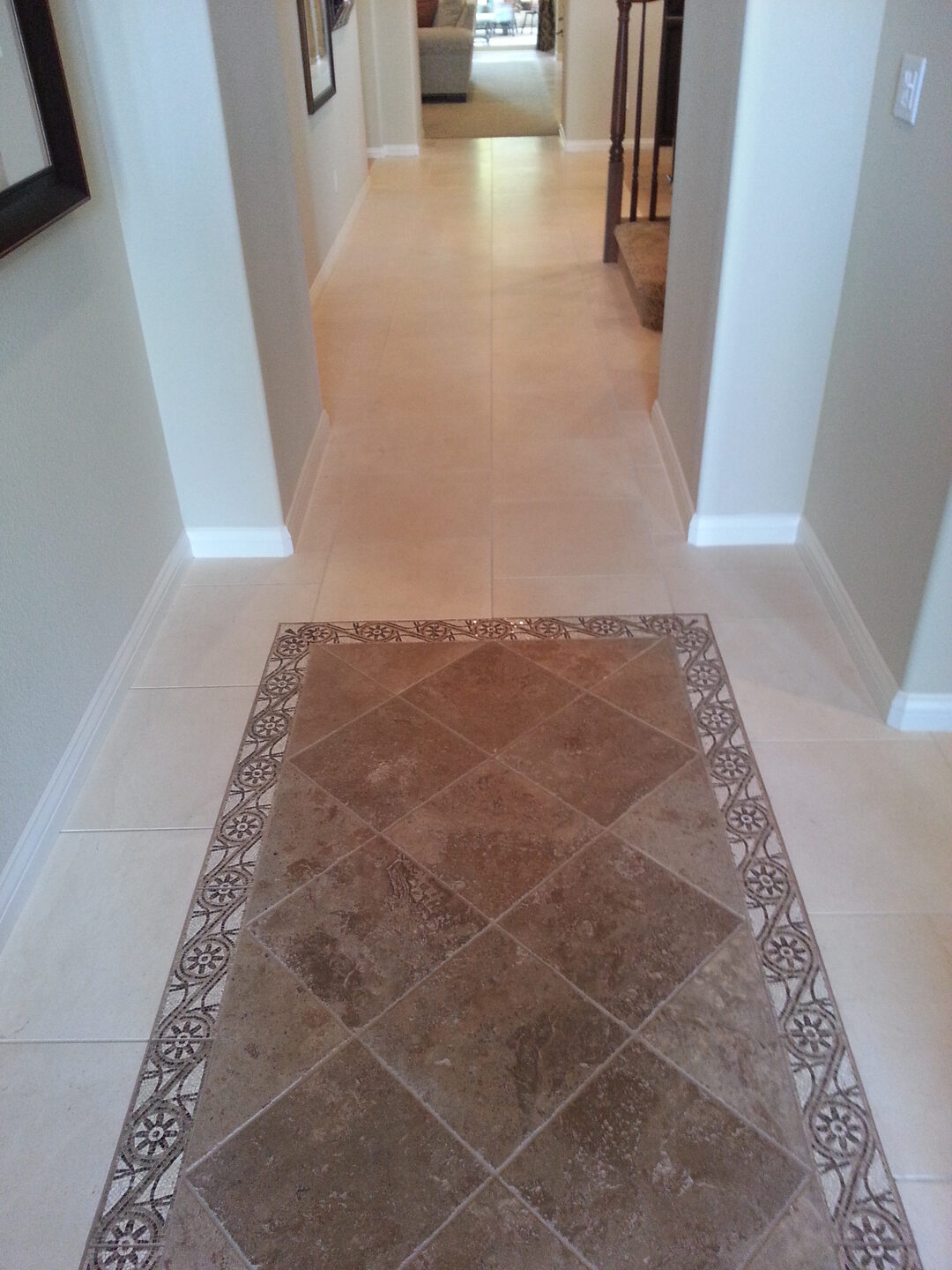 Modern hallway featuring intricate tile work