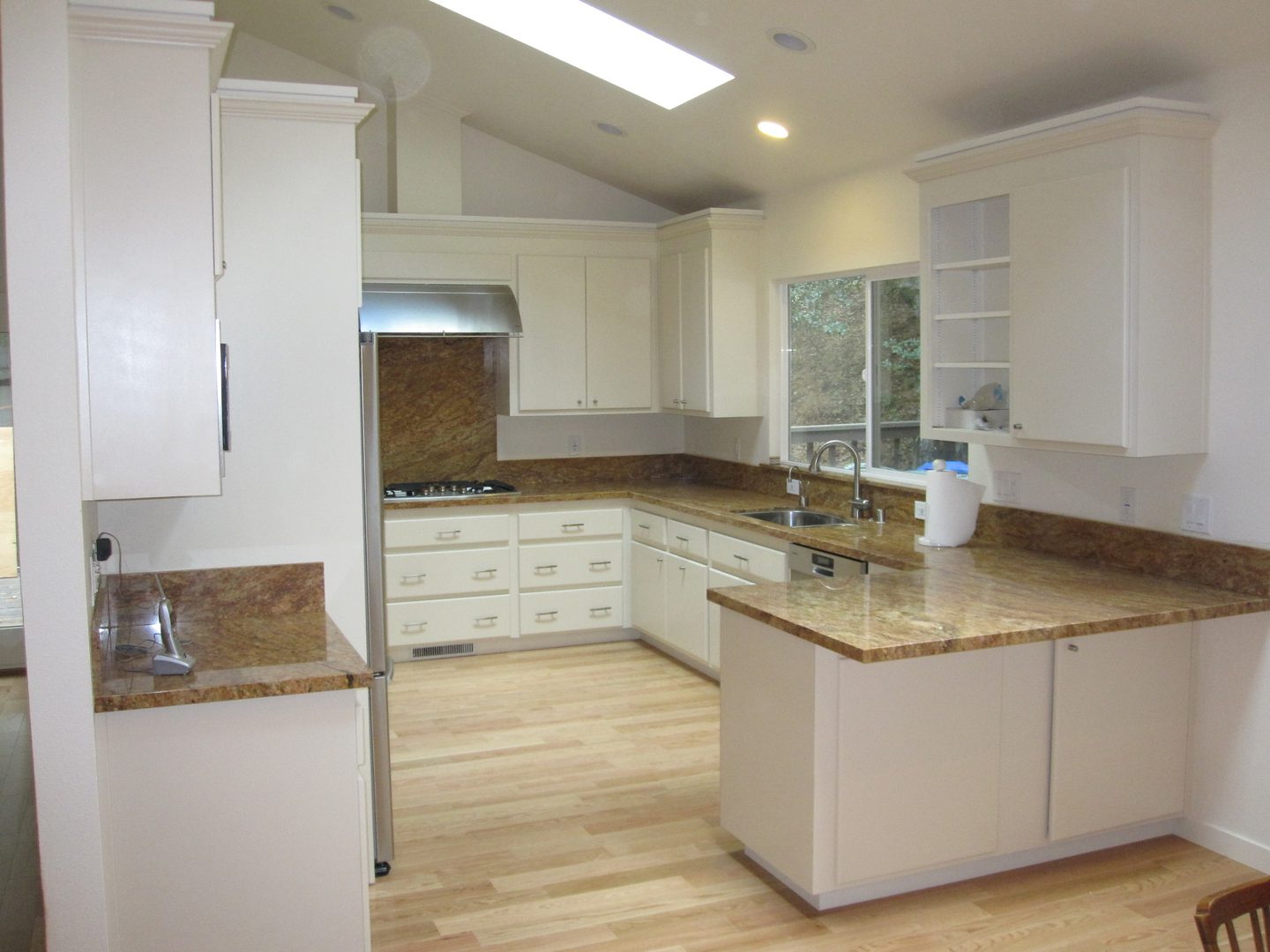 Spacious kitchen with wooden flooring