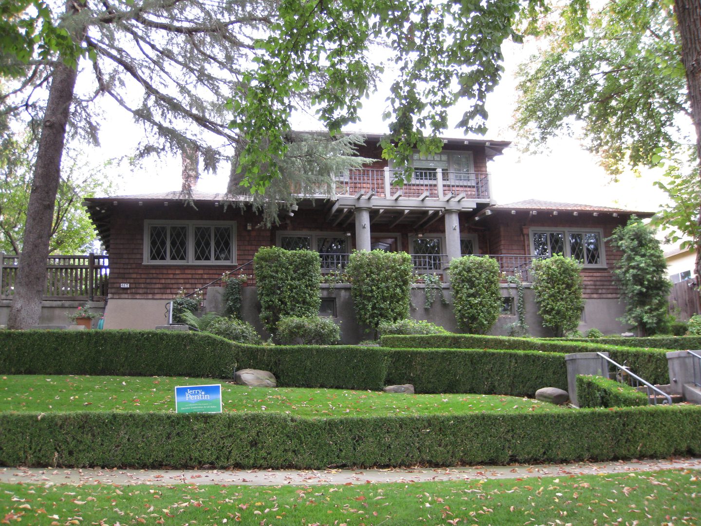 Craftsman-style house with lush greenery