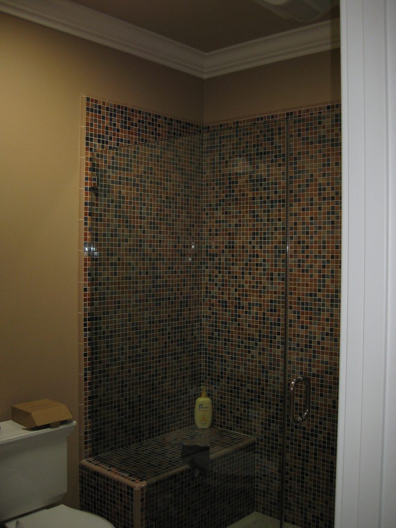 Tiled shower with glass door