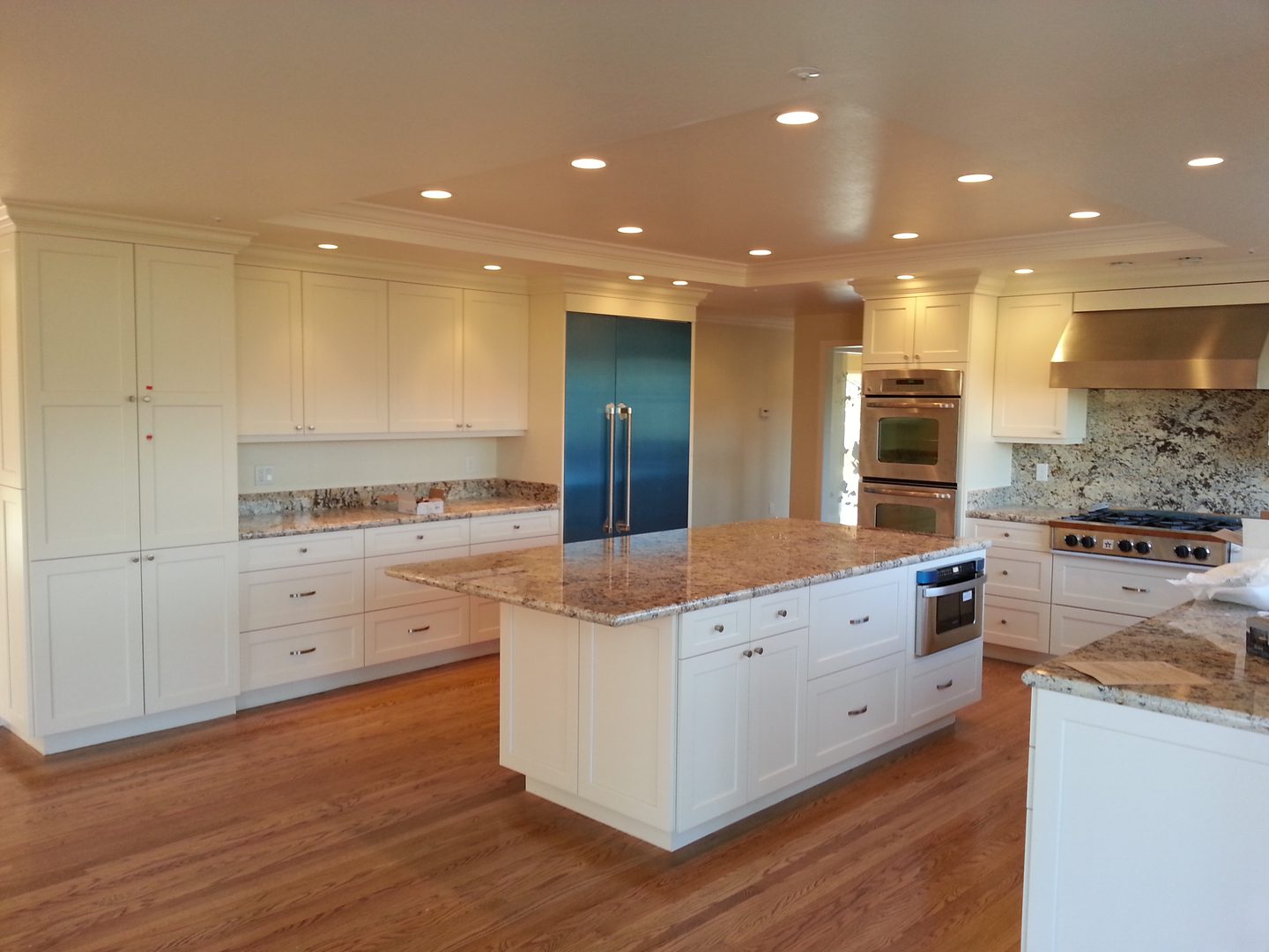 Bright kitchen featuring wooden floors