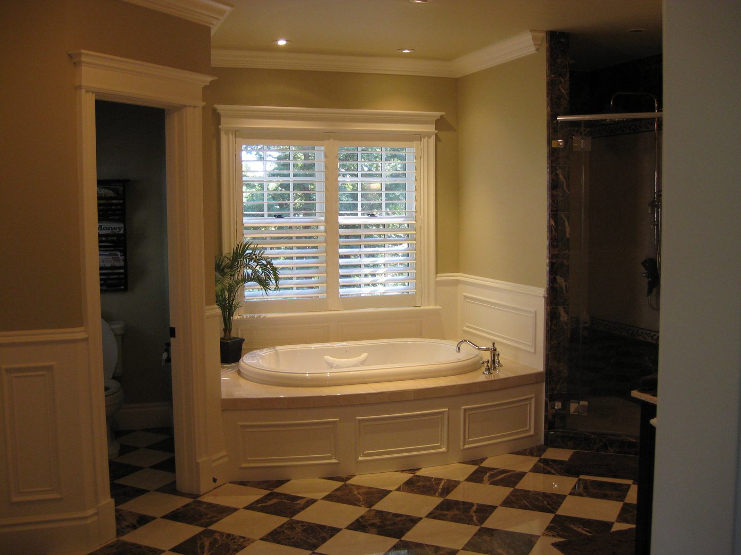 Elegant bathroom with bathtub and checkered floor